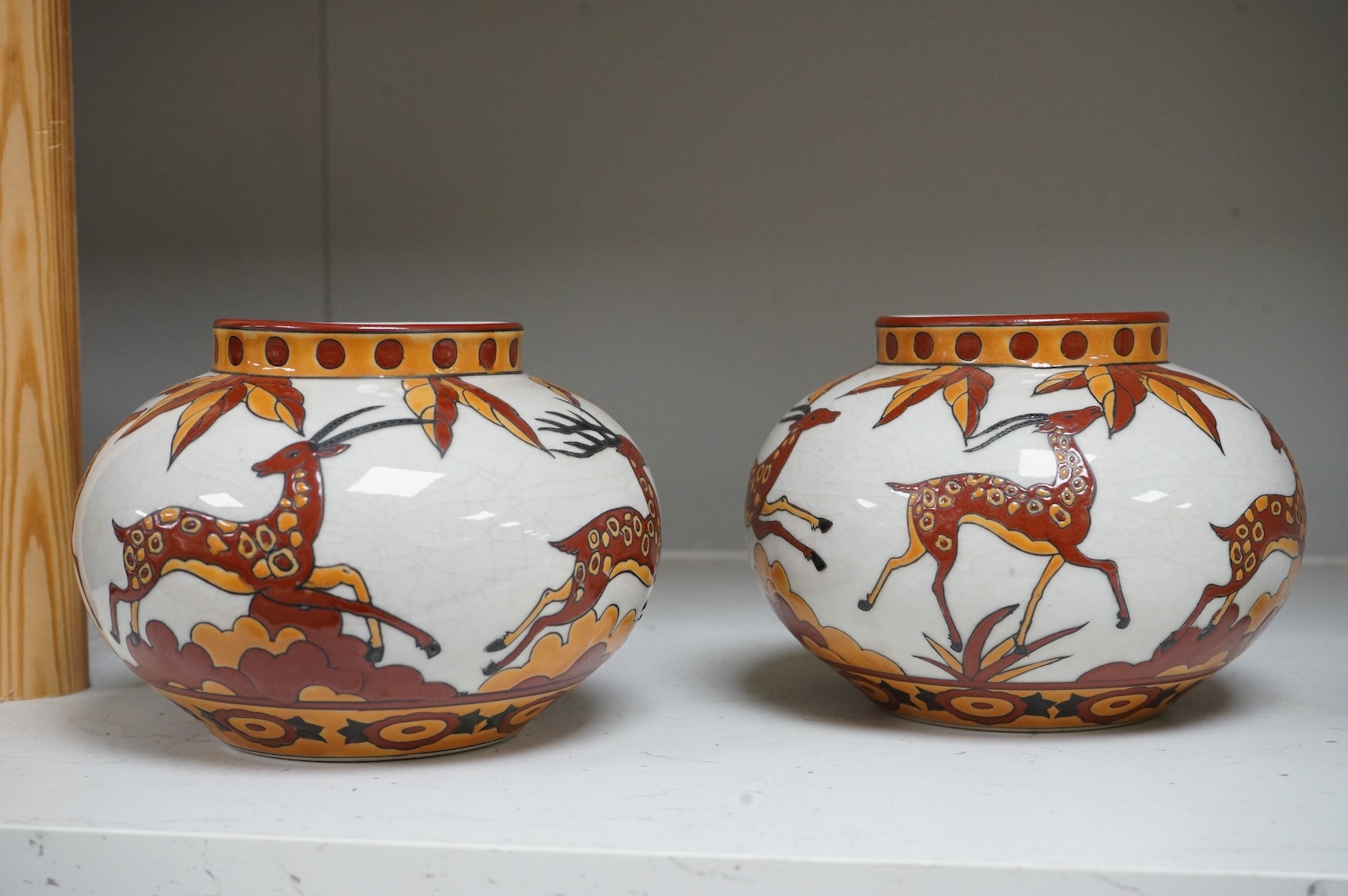 A pair of contemporary Boch Keramis pottery 'leaping deer' vases